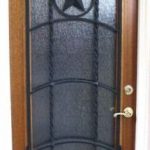A door with a star on it and glass.
