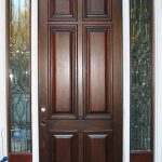 A door with two side panels and one of the doors has six panes.